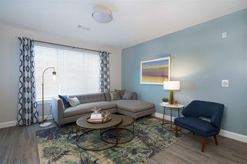 Living room with oversized window with blinds